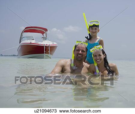 Family with snorkeling gear in water, Florida, United States View Large Photo Image Stock Image - Family with snorkeling gear in water, Florida, United States. Fotosearch