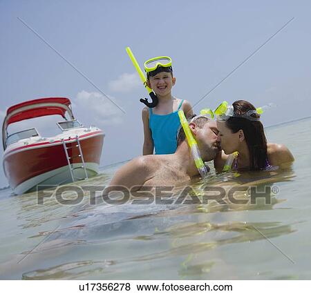 Stock Photo - Family with snorkeling gear in water, Florida, United States. Fotosearch