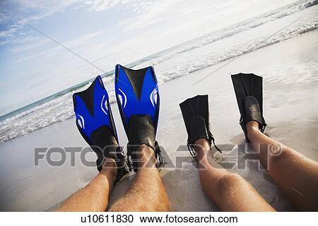 Father and child wearing flippers, Florida, United States View Large Photo Image Stock Image - Father and child wearing flippers, Florida, United States. Fotosearch