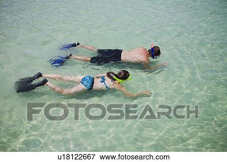 Father and daughter snorkeling in water, Florida, United States View Large Photo Image Stock Photo - Father and daughter snorkeling in water, Florida, United States. Fotosearch