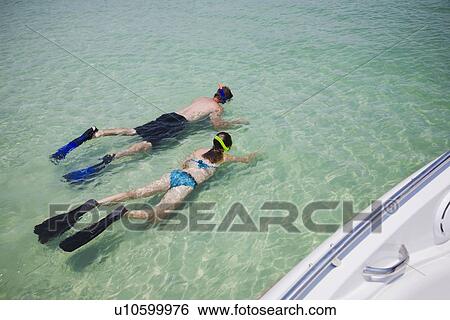 Father and daughter snorkeling in water, Florida, United States View Large Photo Image Stock Photograph - Father and daughter snorkeling in water, Florida, United States. Fotosearch