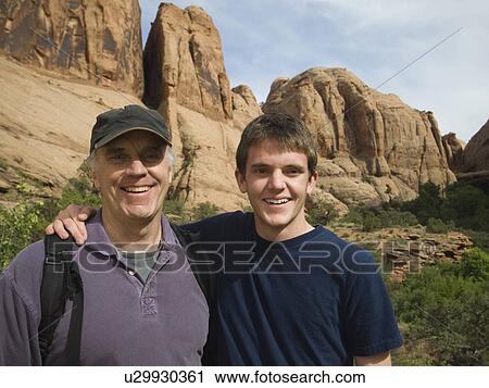 Father and son hugging View Large Photo Image Stock Image - Father and son hugging. Fotosearch