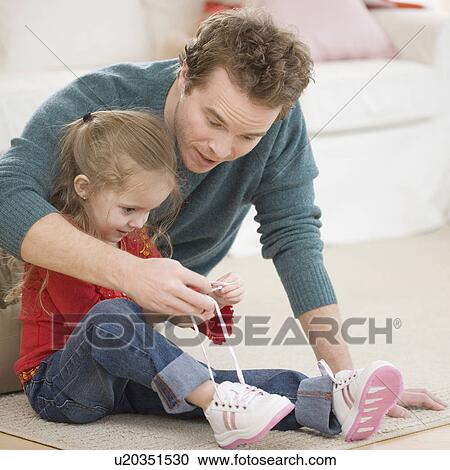 Father teaching daughter how to tie shoe View Large Photo Image Stock Image - Father teaching daughter how to tie shoe. Fotosearch