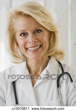 Female doctor with stethoscope around neck View Large Photo Image Stock Image - Female doctor with stethoscope around neck . Fotosearch