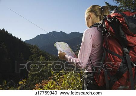 Female hiker looking at map, Utah, United States View Large Photo Image Stock Image - Female hiker looking at map, Utah, United States. Fotosearch