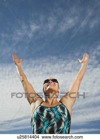 Female swimmer with arms raised, Utah, United States View Large Photo Image Picture - Female swimmer with arms raised, Utah, United States. Fotosearch