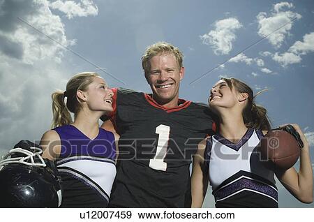 Football player hugging cheerleaders View Large Photo Image Stock Photo - Football player hugging cheerleaders. Fotosearch