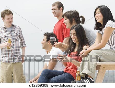 Stock Photo - Friends at party. Fotosearch