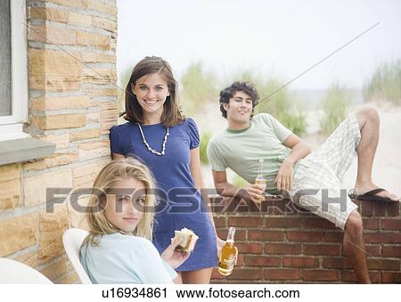 Friends drinking beer outdoors View Large Photo Image Stock Image - Friends drinking beer outdoors. Fotosearch