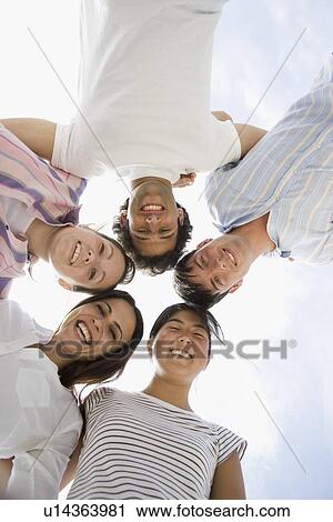 Friends in huddle View Large Photo Image Stock Image - Friends in huddle. Fotosearch