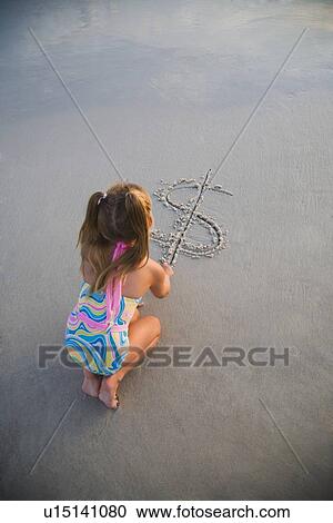 Girl drawing dollar sign in sand, Florida, United States View Large Photo Image Stock Image - Girl drawing dollar sign in sand, Florida, United States. Fotosearch