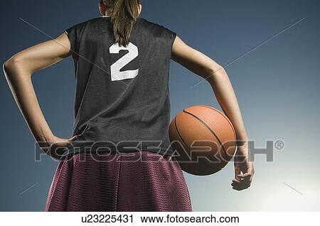 Girl holding basketball View Large Photo Image Stock Image - Girl holding basketball. Fotosearch