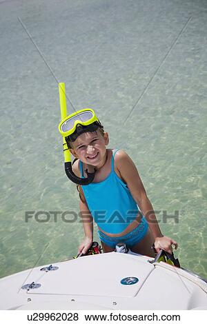 Girl in snorkeling gear climbing onto boat, Florida, United States View Large Photo Image Stock Photo - Girl in snorkeling gear climbing onto boat, Florida, United States. Fotosearch