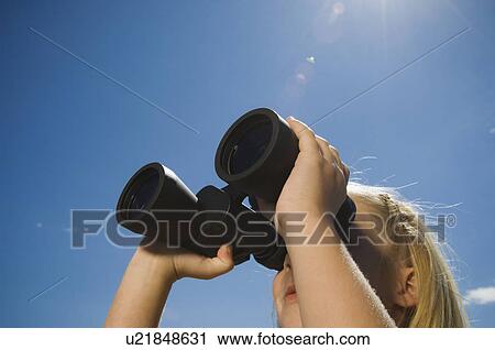 Girl looking through binoculars, Utah, United States View Large Photo Image Stock Image - Girl looking through binoculars, Utah, United States. Fotosearch