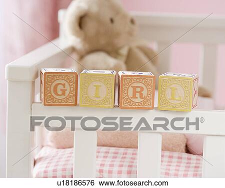 Girl spelled out with blocks on crib View Large Photo Image Stock Photograph - Girl spelled out with blocks on crib. Fotosearch
