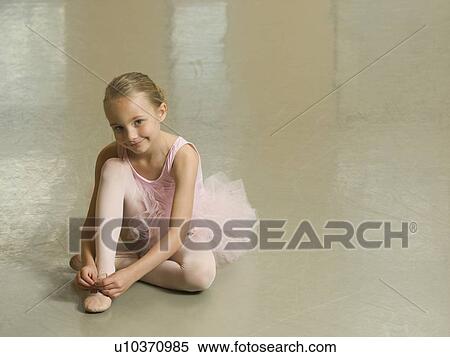 Girl tying ballet shoe View Large Photo Image Stock Photography - Girl tying ballet shoe. Fotosearch