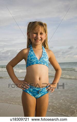 Girl wearing bikini at beach, Florida, United States View Large Photo Image Stock Image - Girl wearing bikini at beach, Florida, United States. Fotosearch