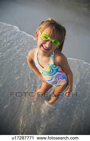 Girl wearing goggles at beach, Florida, United States View Large Photo Image Stock Image - Girl wearing goggles at beach, Florida, United States. Fotosearch