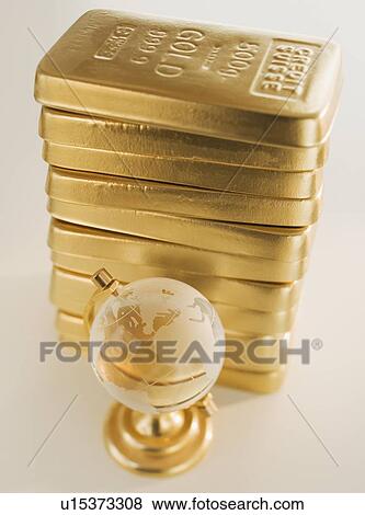 Globe next to stack of gold bars View Large Photo Image Stock Photo - Globe next to stack of gold bars. Fotosearch