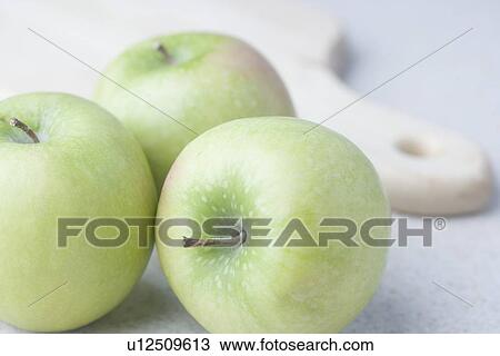 Green apples with cutting board View Large Photo Image Stock Image - Green apples with cutting board. Fotosearch