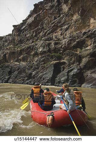 Stock Photo - Group of people river rafting. Fotosearch