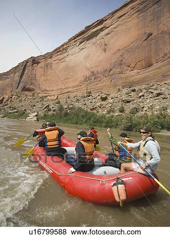Stock Photo - Group of people river rafting. Fotosearch