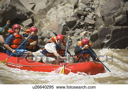 Stock Photography - Group of people river rafting. Fotosearch