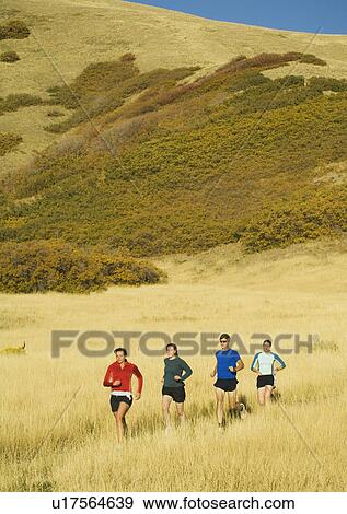 Group of people running in field, Salt Flats, Utah, United States View Large Photo Image Stock Photo - Group of people running in field, Salt Flats, Utah, United States. Fotosearch