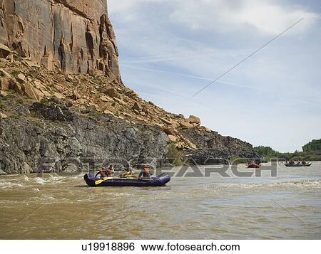 Stock Photograph - Groups of people river rafting. Fotosearch