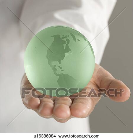 Picture - Hand holding globe. Fotosearch