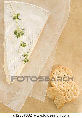Stock Image - High angle view of crackers and cheese. Fotosearch