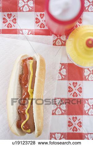 High angle view of hot dog with ketchup and mustard View Large Photo Image Stock Photo - High angle view of hot dog with ketchup and mustard. Fotosearch