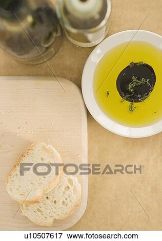 High angle view of sliced bread and oil and vinegar View Large Photo Image Stock Photo - High angle view of sliced bread and oil and vinegar. Fotosearch