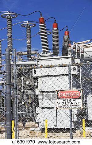 Stock Image - High voltage station with Danger sign. Fotosearch