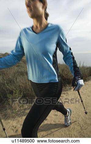 Hispanic woman pole walking along coast in California, United States View Large Photo Image Stock Image - Hispanic woman pole walking along coast in California, United States. Fotosearch