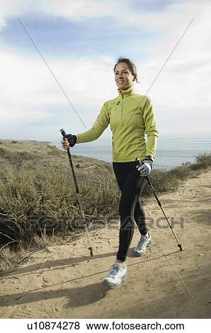 Hispanic woman pole walking along coast in California, United States View Large Photo Image Stock Photo - Hispanic woman pole walking along coast in California, United States. Fotosearch
