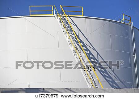 Stock Photo - Ladder on cylindrical container. Fotosearch