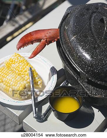 Lobster claw next to butter and corn, Maine, United States View Large Photo Image Picture - Lobster claw next to butter and corn, Maine, United States. Fotosearch