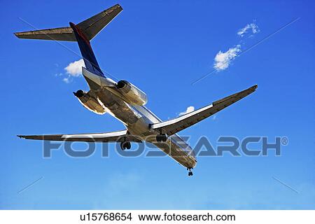 Picture - Low angle view of airplane in flight. Fotosearch