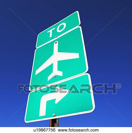 Stock Photograph - Low angle view of airport street sign. Fotosearch