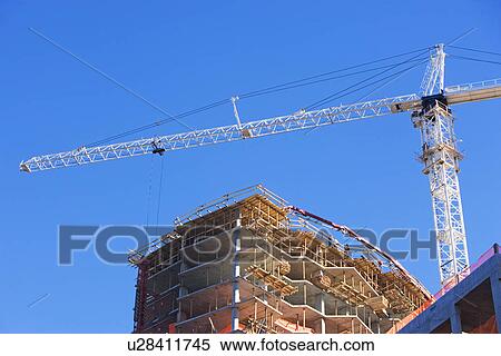 Low angle view of construction site and crane View Large Photo Image Stock Photography - Low angle view of construction site and crane. Fotosearch