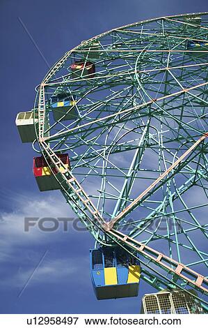 Stock Photo - Low angle view of ferris wheel. Fotosearch
