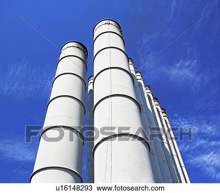 Low angle view of industrial silos View Large Photo Image Stock Image - Low angle view of industrial silos. Fotosearch