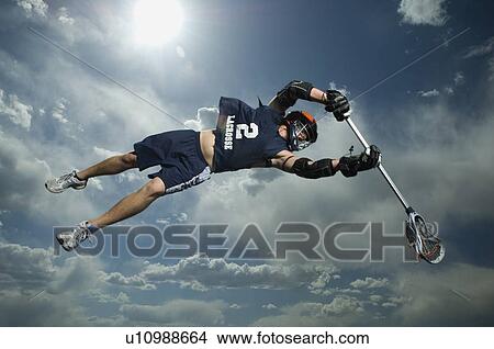 Low angle view of jai-alai player jumping View Large Photo Image Picture - Low angle view of jai-alai player jumping. Fotosearch