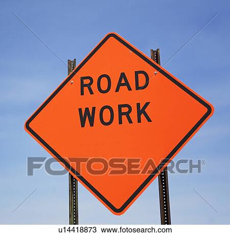 Stock Image - Low angle view of Road Work sign. Fotosearch