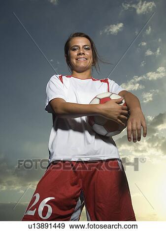 Low angle view of soccer player View Large Photo Image Stock Photo - Low angle view of soccer player. Fotosearch