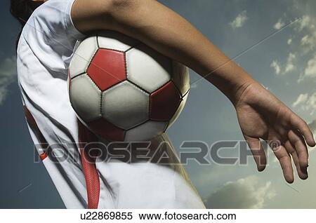 Stock Photography - Low angle view of soccer player. Fotosearch
