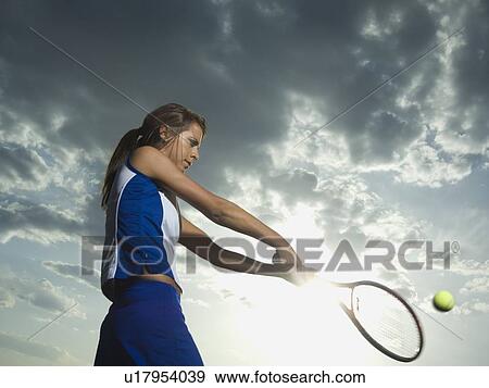 Low angle view of tennis player View Large Photo Image Stock Photo - Low angle view of tennis player. Fotosearch