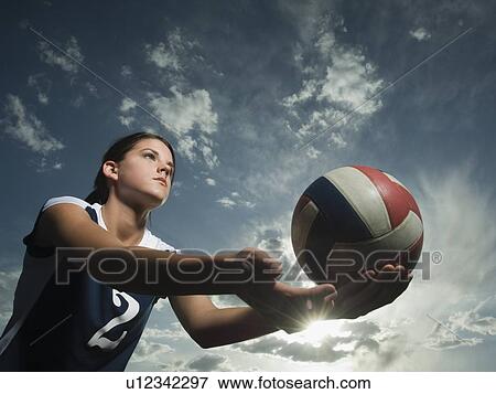 Stock Photo - Low angle view of volleyball player. Fotosearch