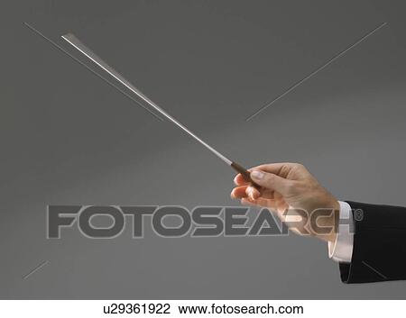Male conductor’s hand holding baton View Large Photo Image Stock Image - Male conductor’s hand holding baton. Fotosearch